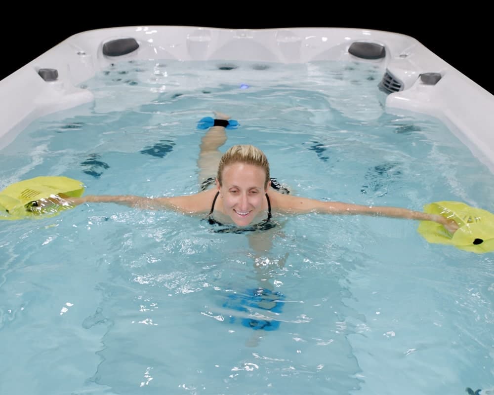 woman exercising in swim spa